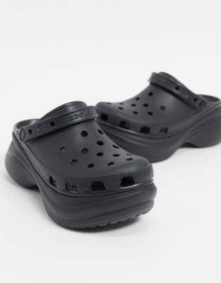 black platform crocs with flowers