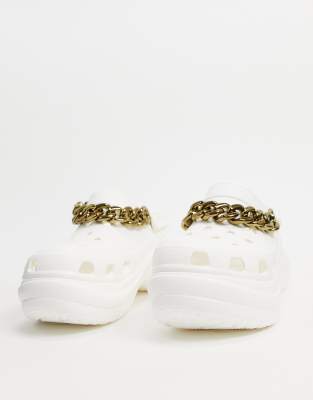 white shoes with gold chain