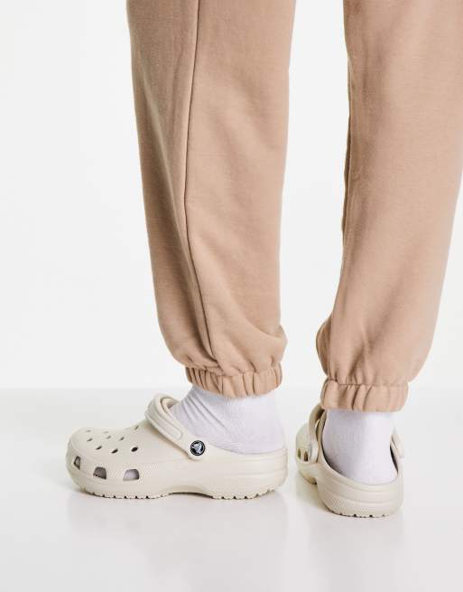 Crocs classic clogs in beige | ASOS