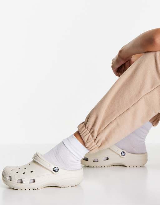 Crocs classic clogs in beige ASOS