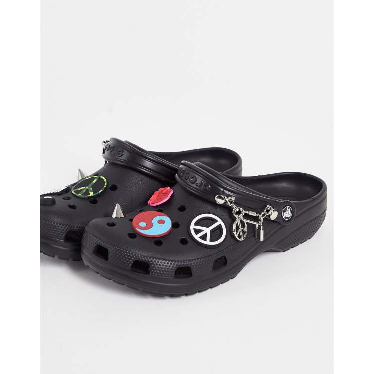 Crocs classic clogs in black with jibbitz ASOS