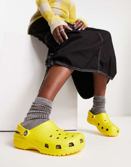 Crocs classic clogs in lemon ASOS