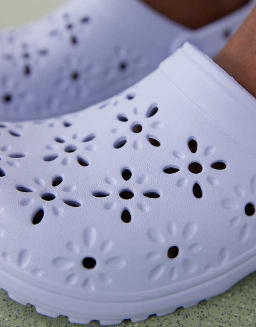 Crocs Classic floral cut-out clogs in blue haze | ASOS