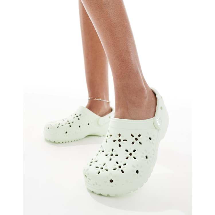 Crocs Classic floral cut-out clogs in jade tint | ASOS