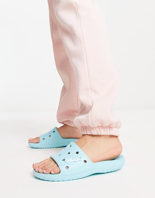 Crocs classic slide flat sandals in ice blue | ASOS