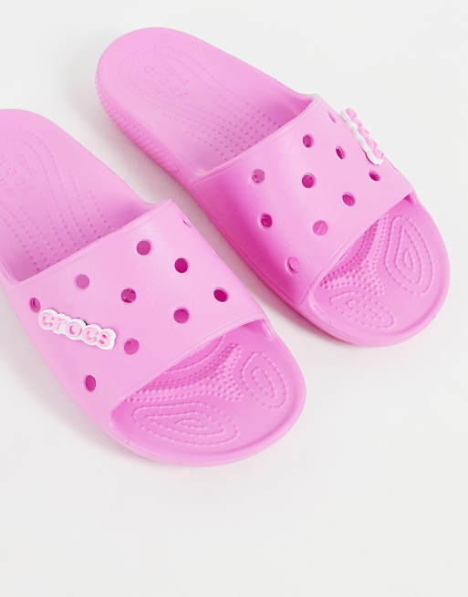 Crocs classic slide flat sandals in taffy pink ASOS