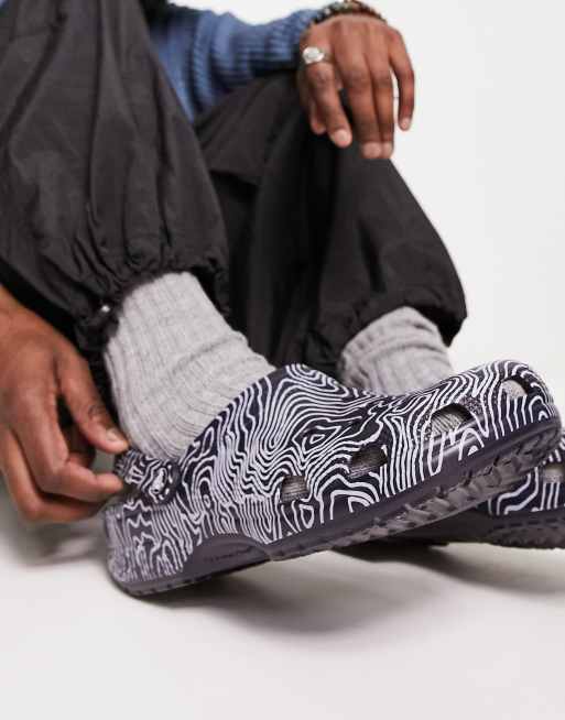 Crocs classic topographic clogs in navy | ASOS
