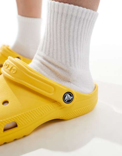 Crocs unisex classic clogs in sunflower yellow ASOS