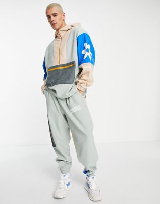 Crooked Tongues co-ord fleece colour blocking half zip hoodie with daisy print in multi