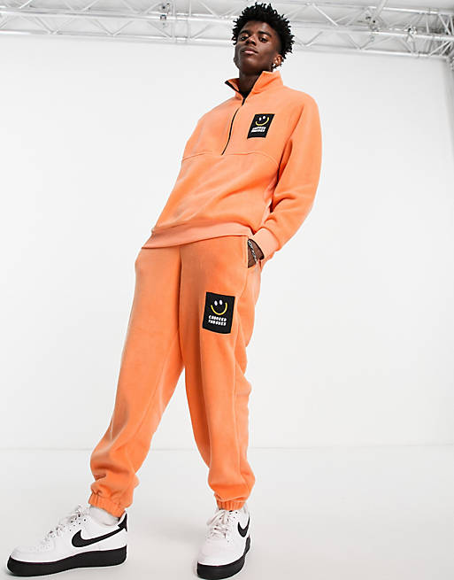 Crooked Tongues co-ord fleece jogger in orange