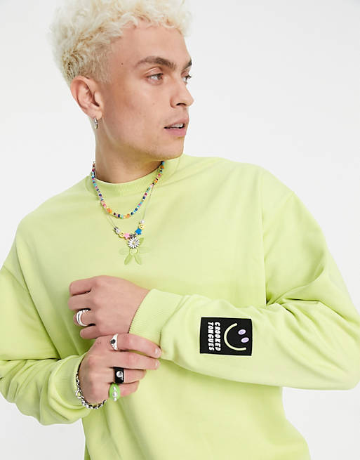 Crooked Tongues co-ord sweatshirt with flower logo and badge in green