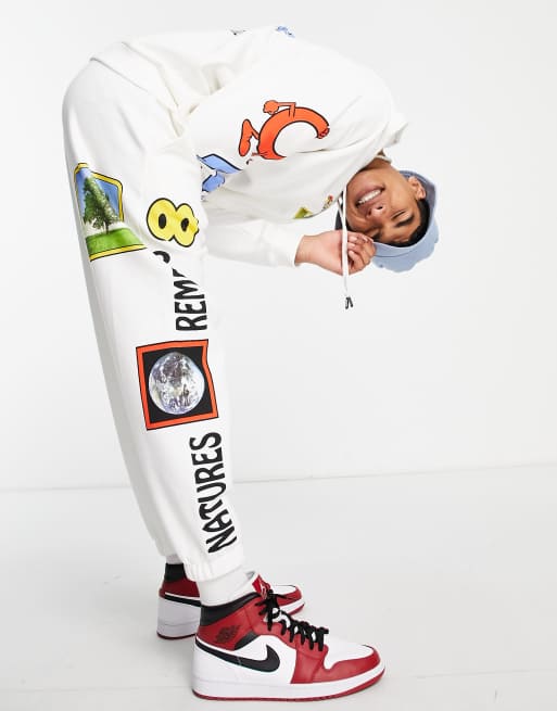 Crooked Tongues - Joggers bianchi con tre stampe grafiche multicolore in coordinato