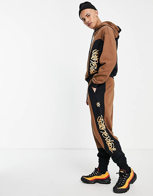 Crooked Tongues joggers with quilted panels in brown