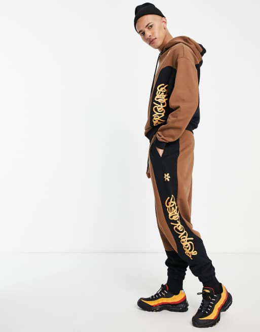 Crooked Tongues - Joggingbroek met doorgestikte inzetstukken in bruin
