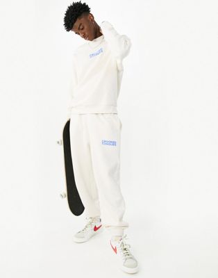 Crooked Tongues logo relaxed jogger in ecru - ASOS Price Checker