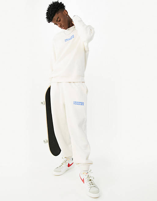 Crooked Tongues logo relaxed jogger in ecru