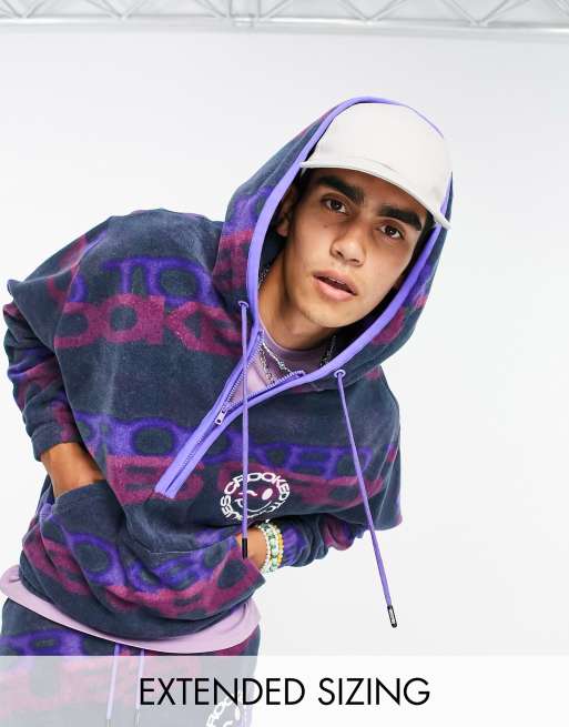 Crooked Tongues – Oversize-Kapuzenpullover aus Polarfleece in Blau mit All-over-Logoprint, Kombiteil