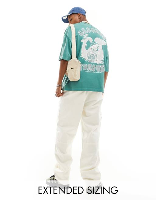 Crooked Tongues oversized premium washed t-shirt in green with cartoon back print
