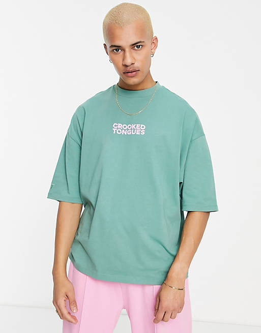 Crooked Tongues oversized t-shirt with record man print in green