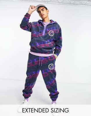 Crooked Tongues relaxed polar fleece sweatpants all-over logo print in blue - part of a set-Navy