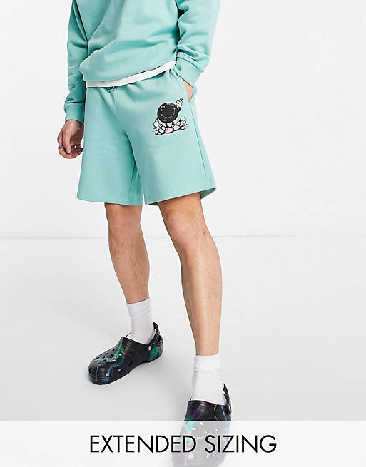 Crooked Tongues relaxed shorts with bowling graphic print in teal green