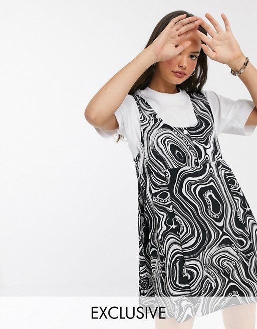 Crooked Tongues swing dress in marble print with popper front