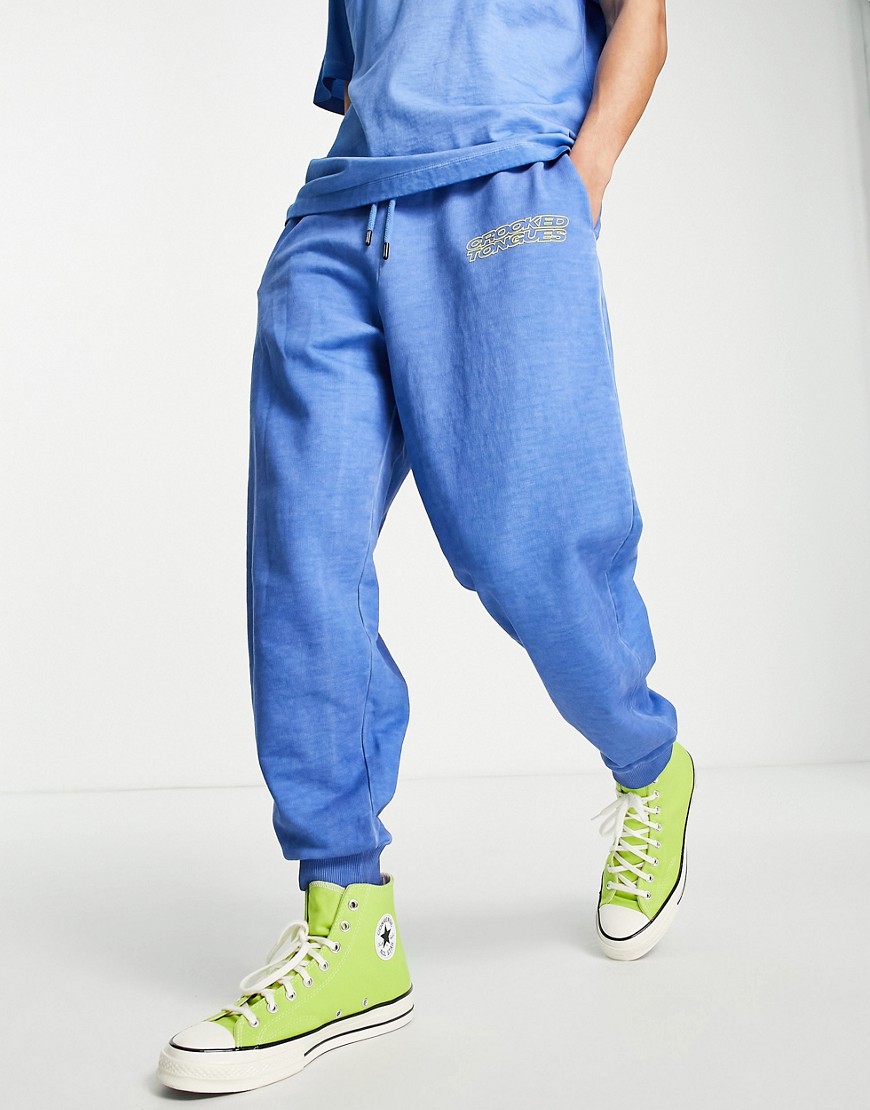 Crooked Tongues washed sweatpants with logo print in blue - part of a set