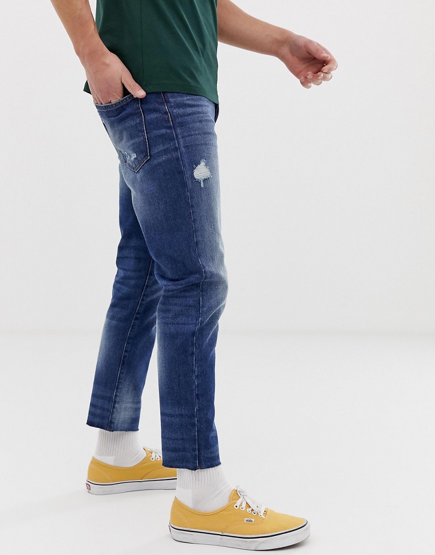 Cropped bukser i mellemvasket blå fra United Colors Of Benetton