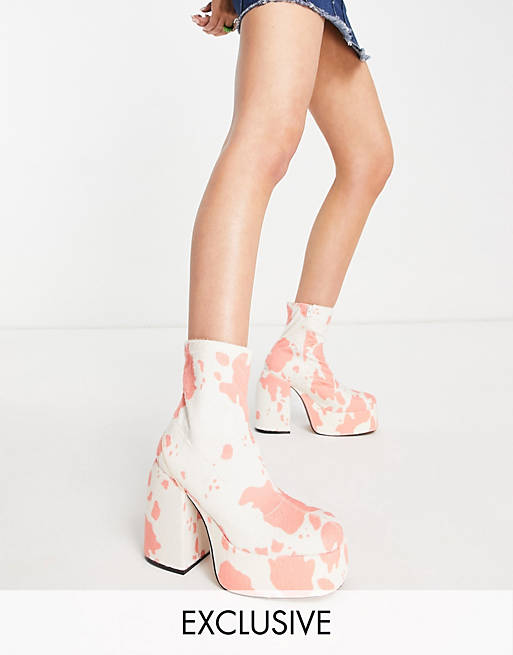 Daisy Street Exclusive platform heeled boots in pink cow print