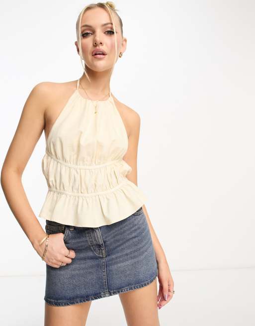 ASOS DESIGN halter cross neck crop top with button detail in light gold