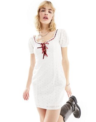 white lace mini milkmaid dress with red ribbon detail