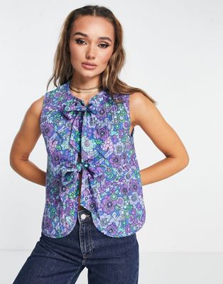 Damson Madder cotton quilted gilet in blue floral