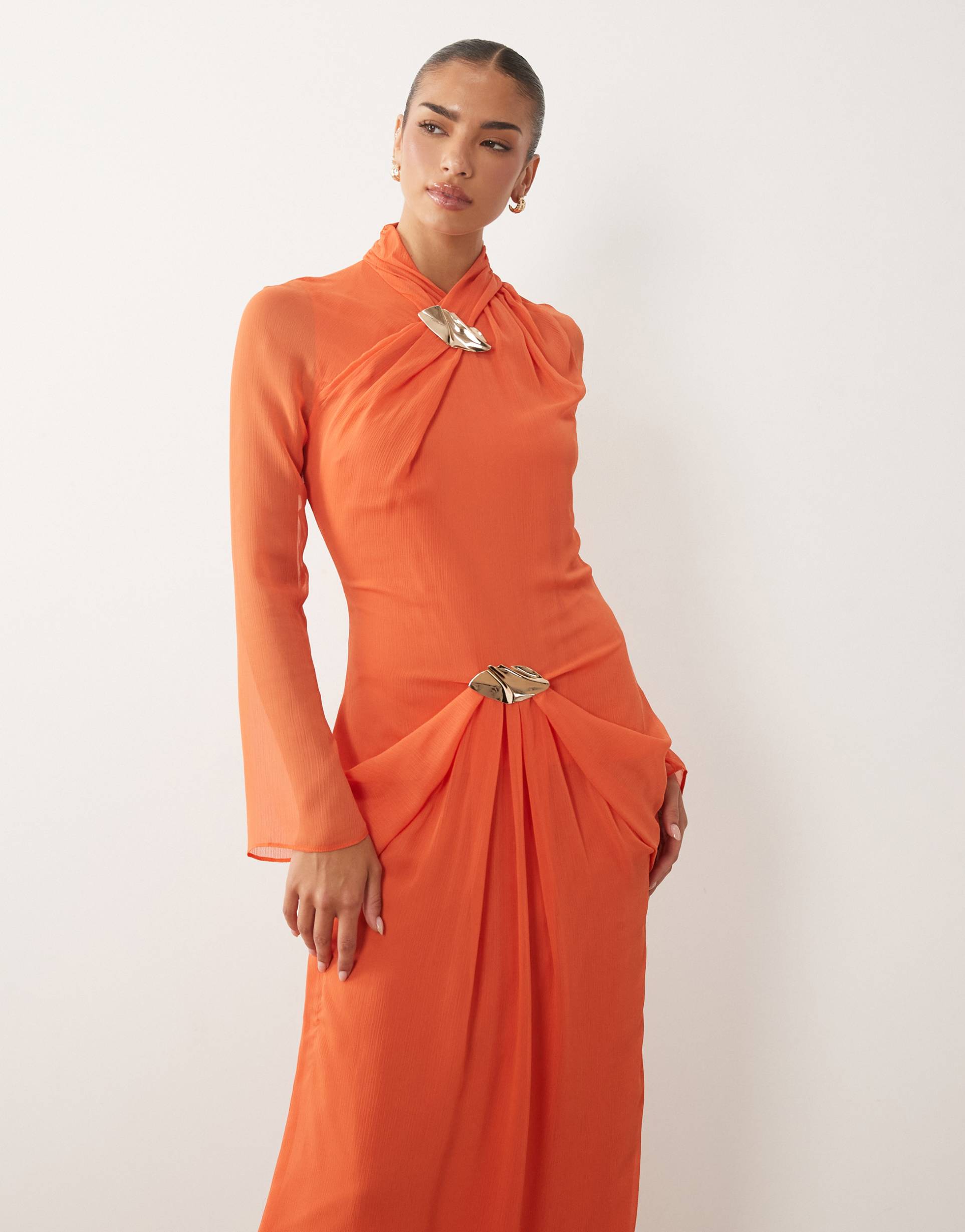 daska ruched long sleeve maxi dress with gold-tone buckle detail in orange