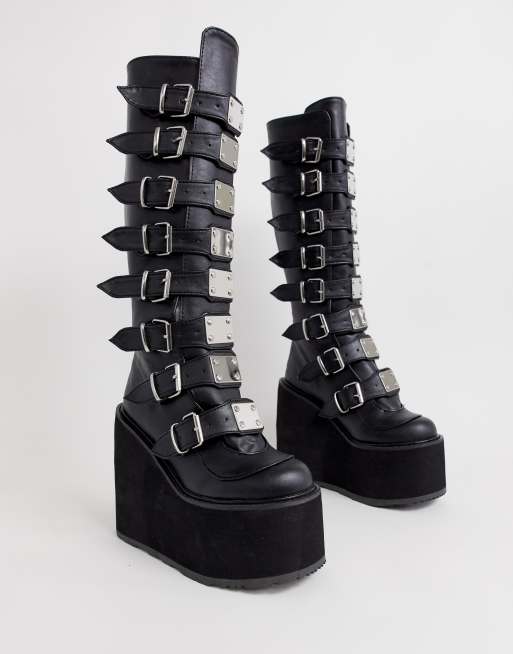 Demonia Swing Buckle Flatform Knee Boots In Black Asos