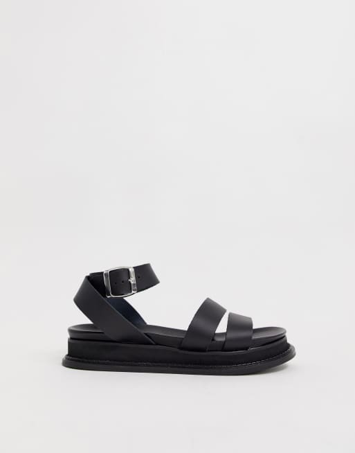 schuh chaser leather chunky buckle sandals in black