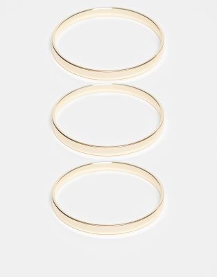 DesignB London - 3er-Pack goldfarbene Armreifen zum Übereinandertragen