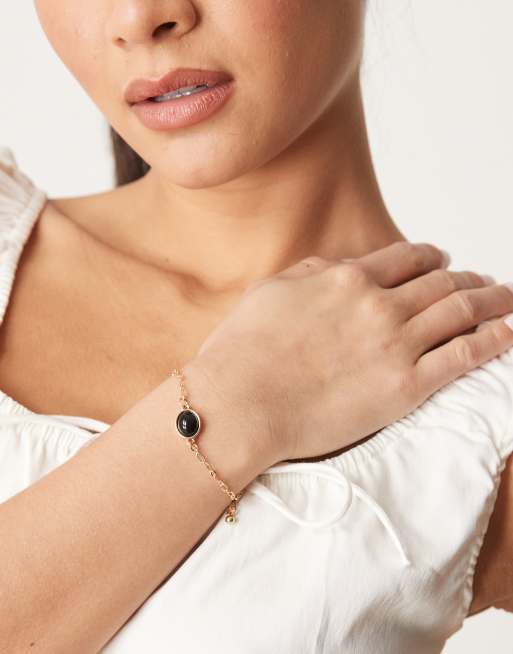 DesignB London - Armband met hangertje met zwarte steen in goud