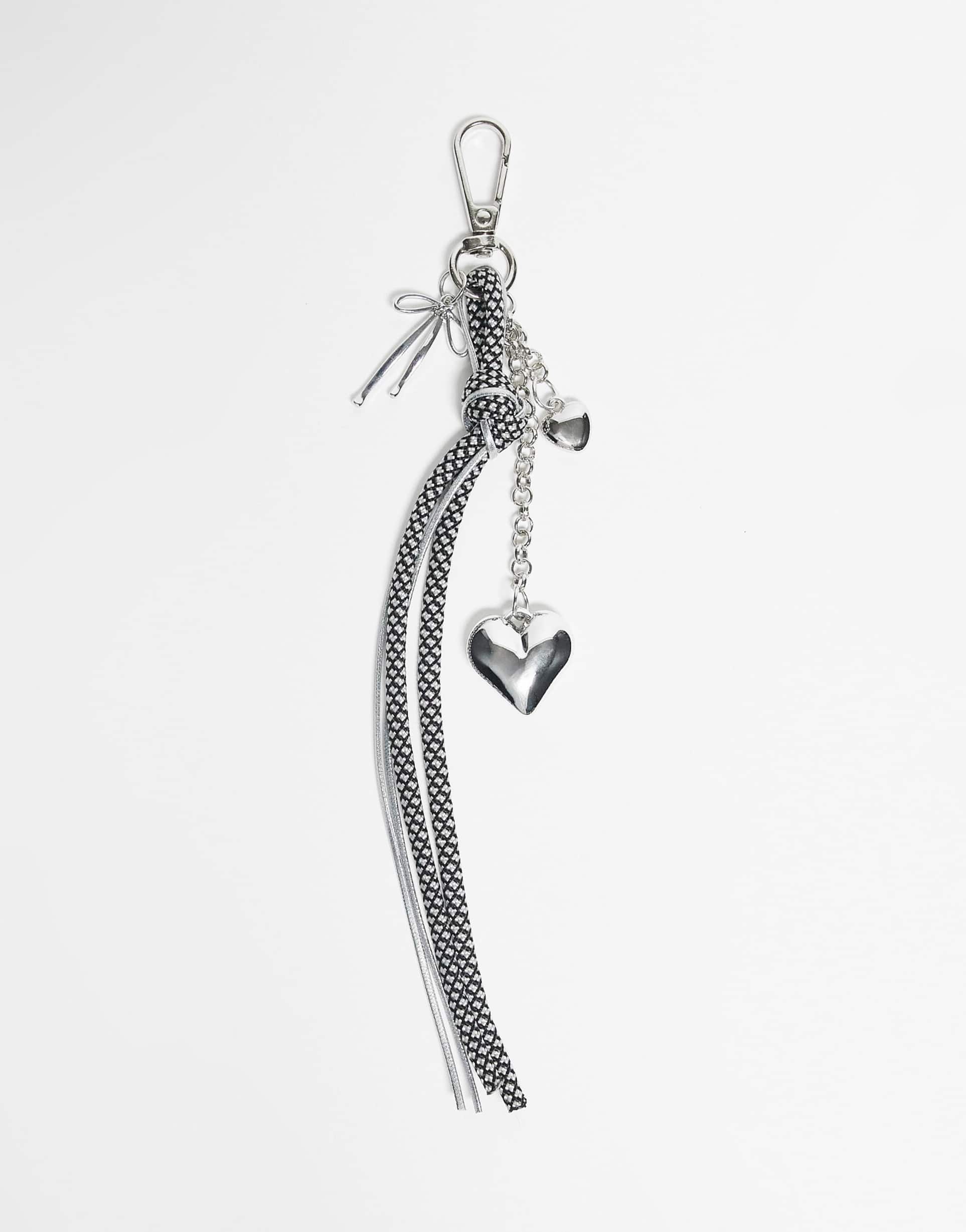 designb london bungee cord and heart bag charm in black and white polka dots