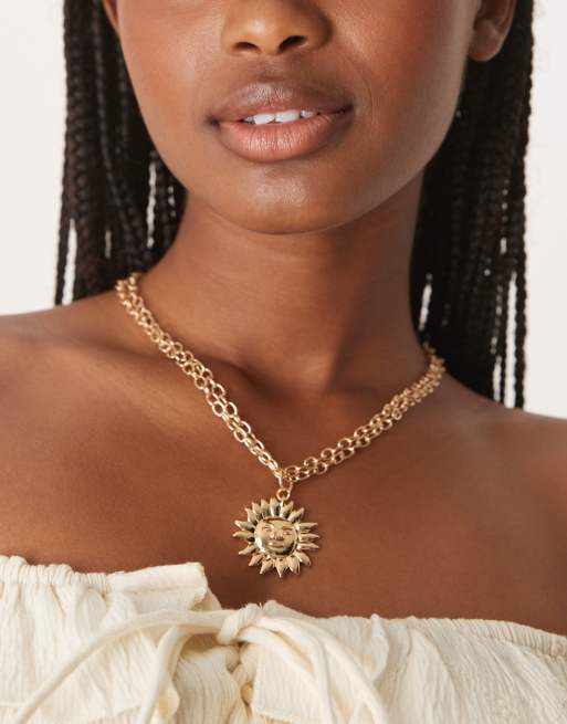 DesignB London - Collana con catenina doppia e pendente a forma di sole color oro