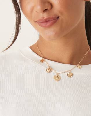 DesignB London - Collier orné de breloques cœur variées - Doré