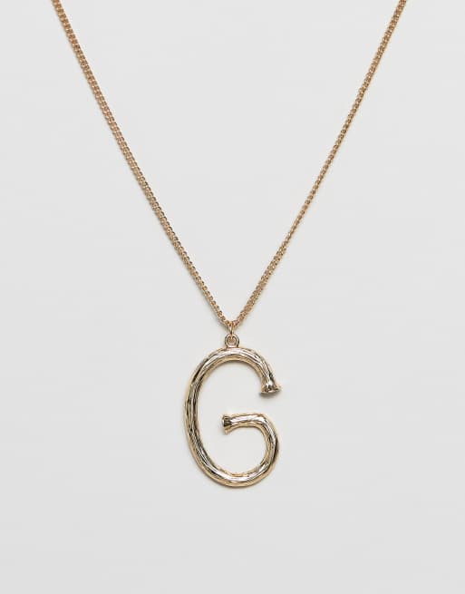 DesignB London – Goldene Halskette mit strukturiertem Initial-Anhänger „G“
