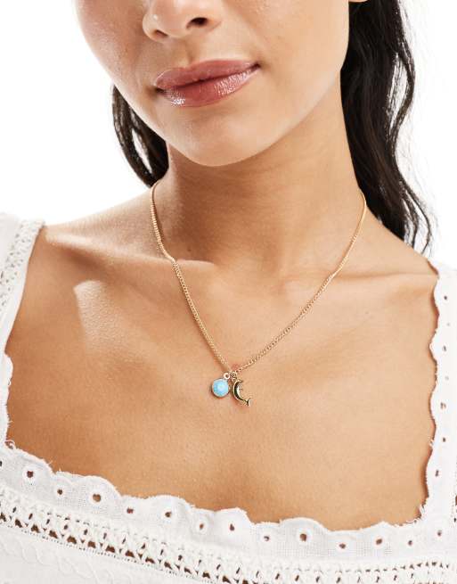 DesignB London - Ketting met dolfijn- en kristalhanger in goud 