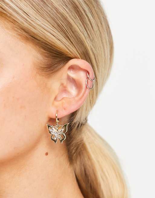 DesignB London - Orecchini pendenti color oro con farfalla con strass