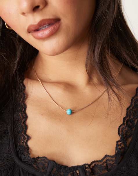 DesignB London - Ronde schakelketting met turquoise kralenhangertje in goud - view 1