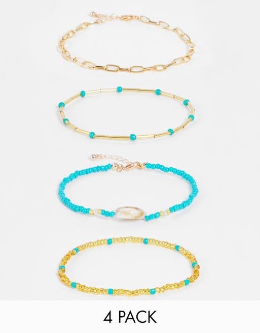 DesignB London - Set van 4 enkelbandjes met kraaltjes en schelp in goudkleur