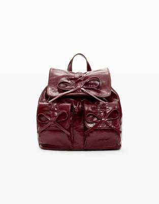 Kleiner, glänzender Rucksack in Rot mit Schleife Rot One Size
