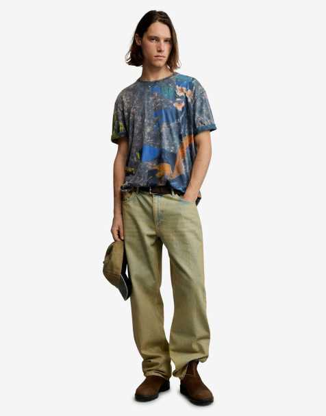 Desigual – T-Shirt in Blau mit künstlerischem Muster - view 1