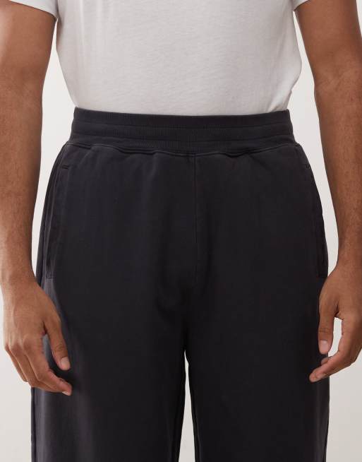 Deus Ex Machina shield garment dyed joggers in washed black, 5 of 5