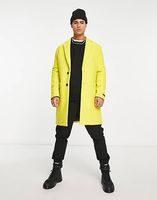 Devil's Advocate longline coat in yellow
