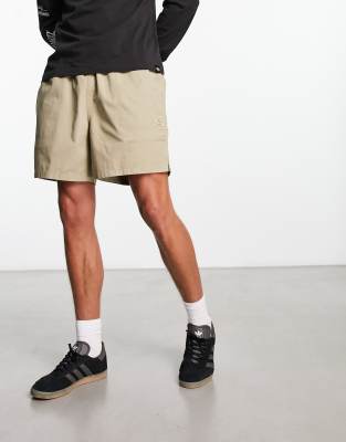 Calvin Klein Jeans - Pantaloncini beige con logo applicato in